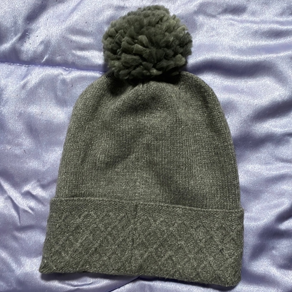 Grey toque with pom on top